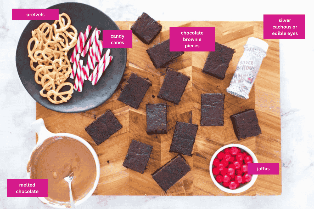 The ingredients for reindeer Christmas brownies on a wooden chopping board.