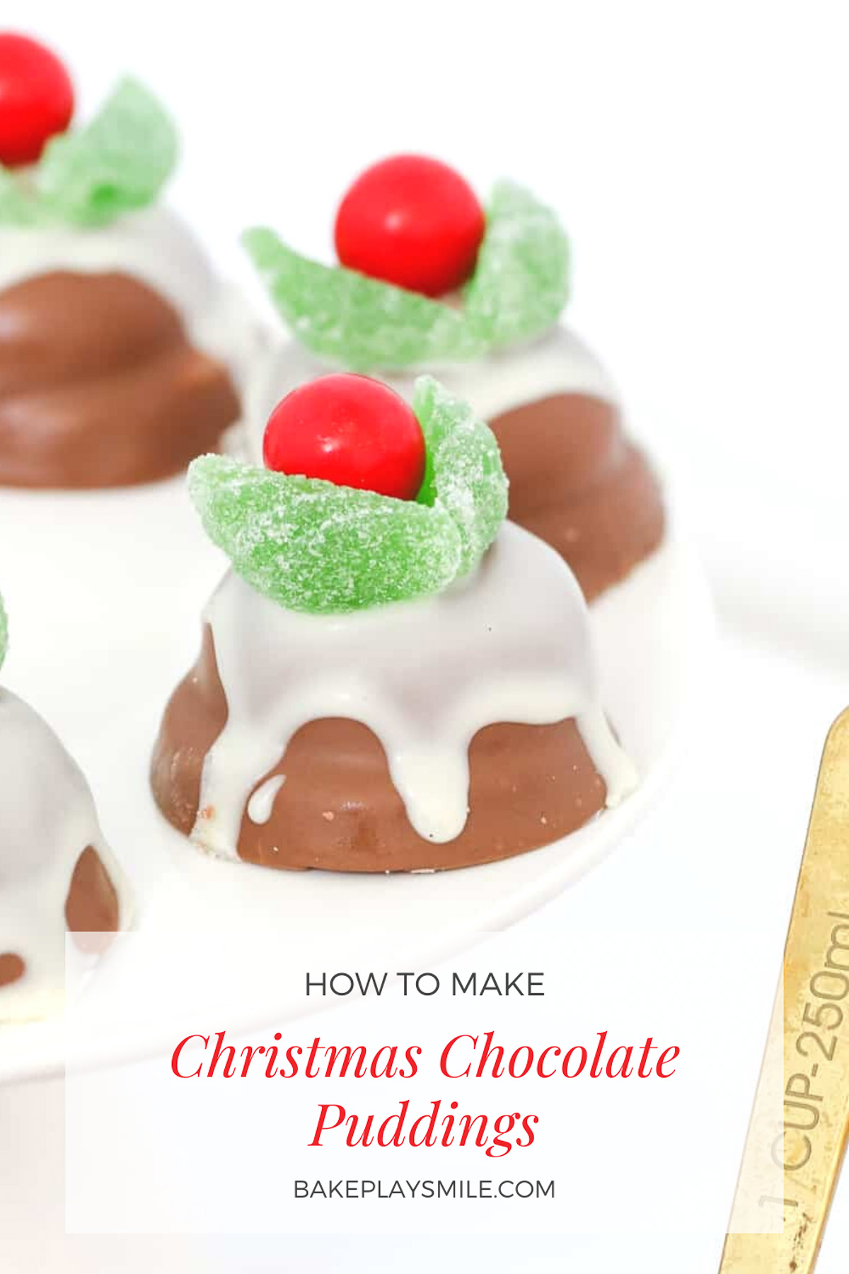 A white plate with chocolate marshmallow biscuits decorated to look like Christmas chocolate puddings.