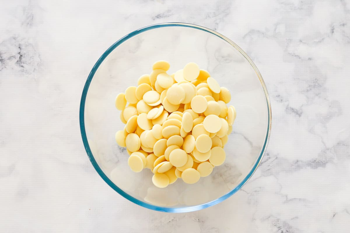 White chocolate baking melts in a glass bowl.