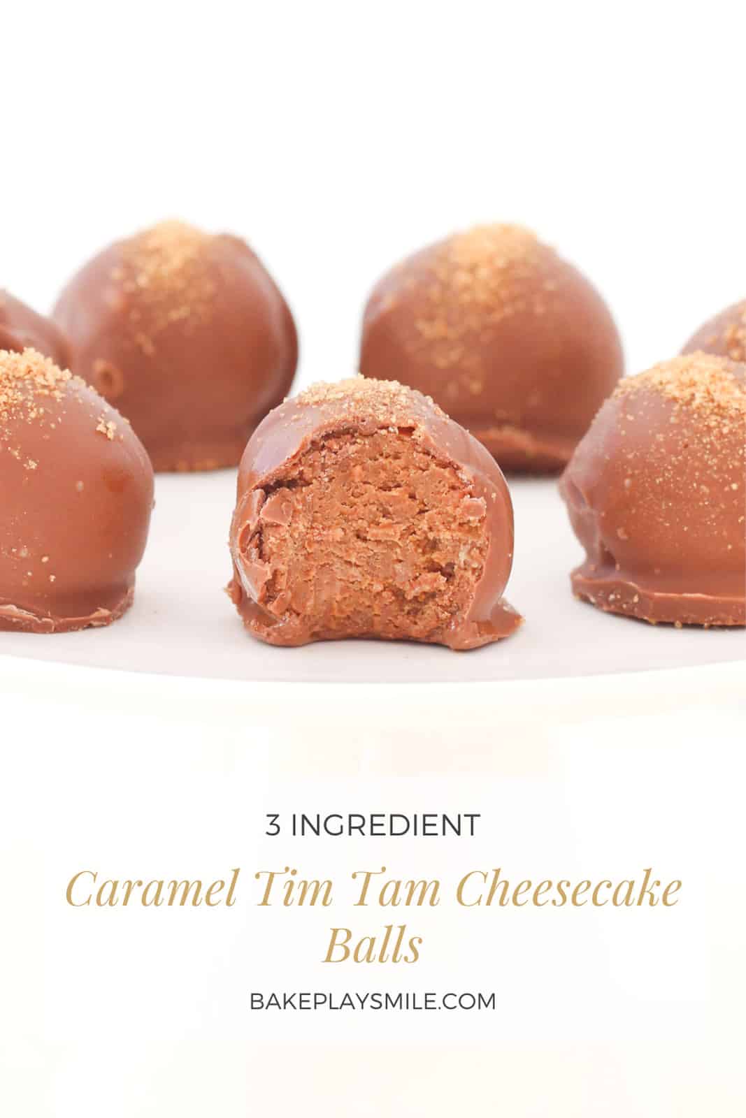 A Pinterest image with the text Caramel Tim Tam Cheesecake Balls and a plate of cheesecake balls with the front one bitten in to to show filling.