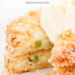 A Pinterest image with the text overlay 'Mashed Potato Cakes' in front of a stack of half eaten potato cakes.