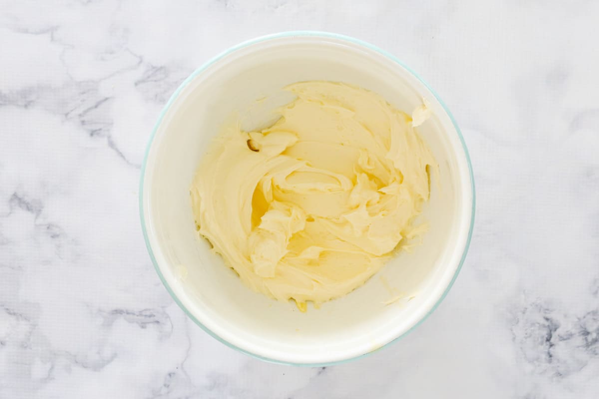 Cream cheese and butter mixed together well in a bowl.