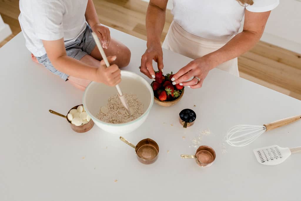 A mum and son baking in the kitchen.