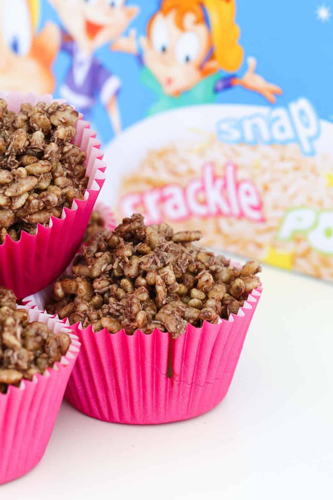 Chocolate crackles in pink paper cases.