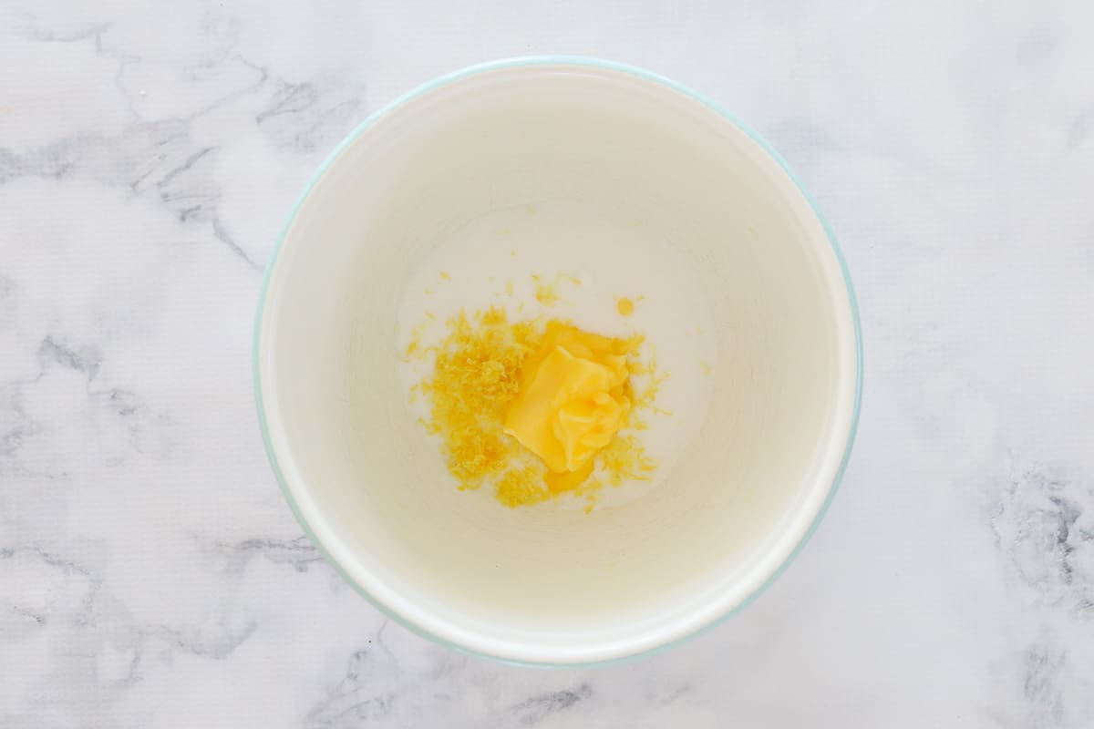 Powdered (icing) sugar, lemon zest, and butter in bowl.