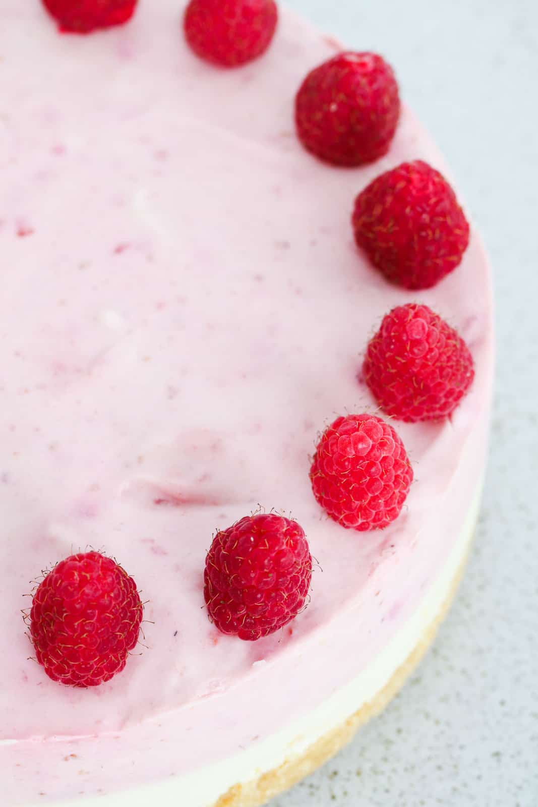 close up shot of no bake white chocolate raspberry cheesecake