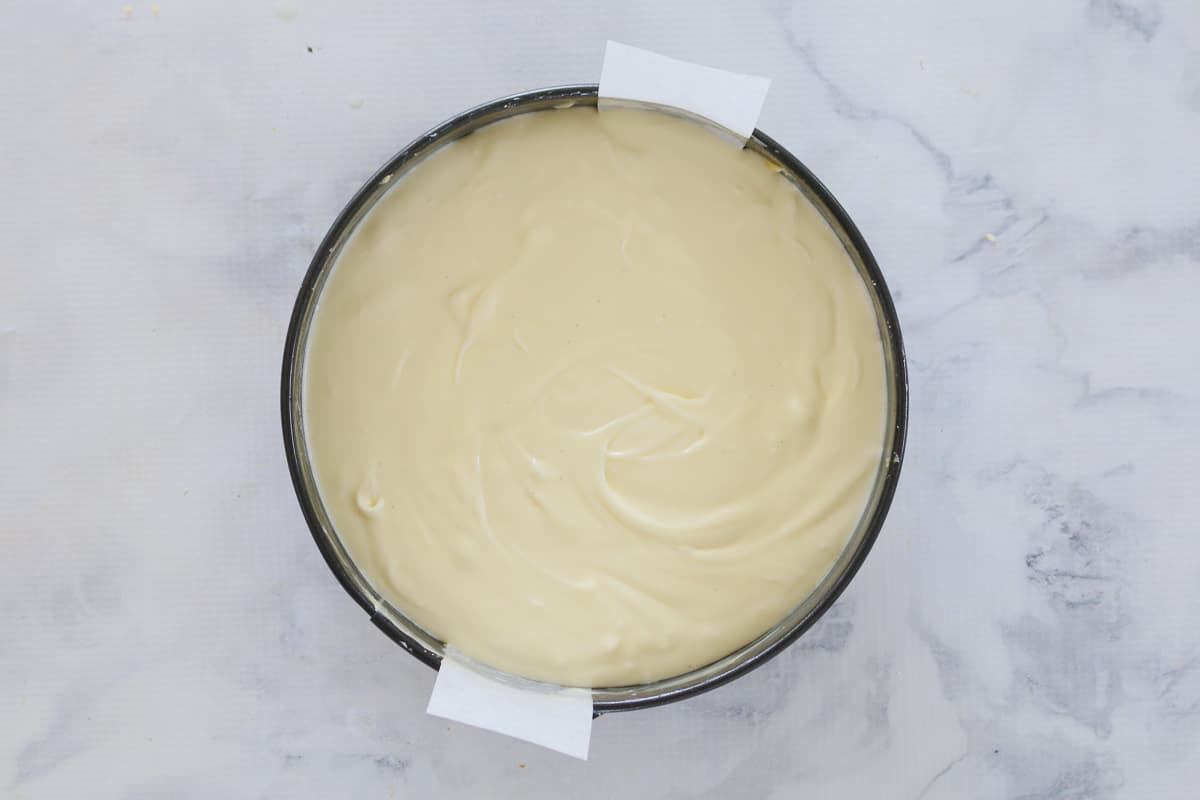 close up of cheesecake setting in pan