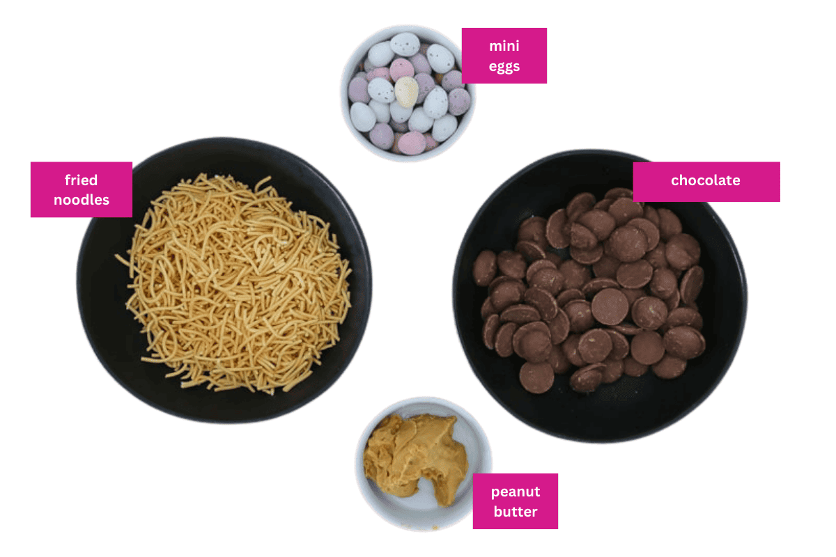 Fried noodles, chocolate, mini easter eggs and peanut butter in small bowls.