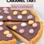 An easter decorated caramel tart with one slice cut and slightly removed.