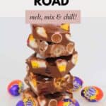 A stack of rocky road pieces loaded with Easter eggs, marshmallows and raspberry lollies.