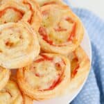 Ham and cheese roll ups in a stack.