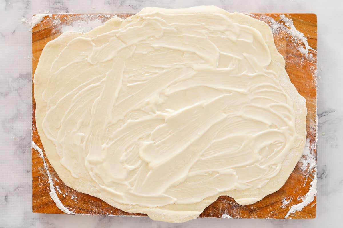 Scroll dough rolled out and spread with mayonnaise