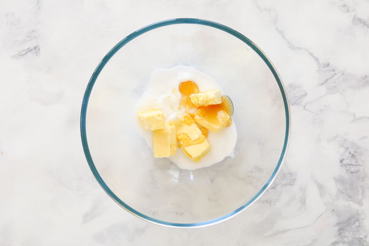 The Honey Joys glaze ingredients - honey, butter & sugar, in a glass bowl.