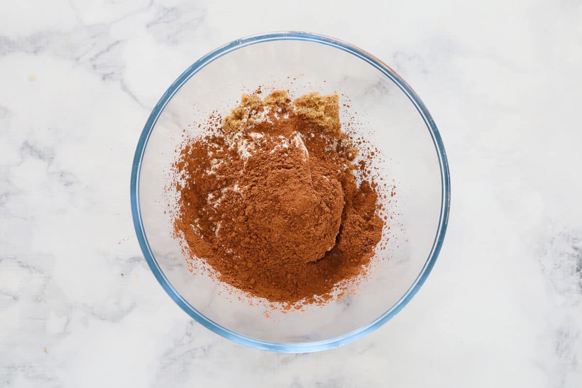 Cocoa powder, flour and brown sugar in a bowl.