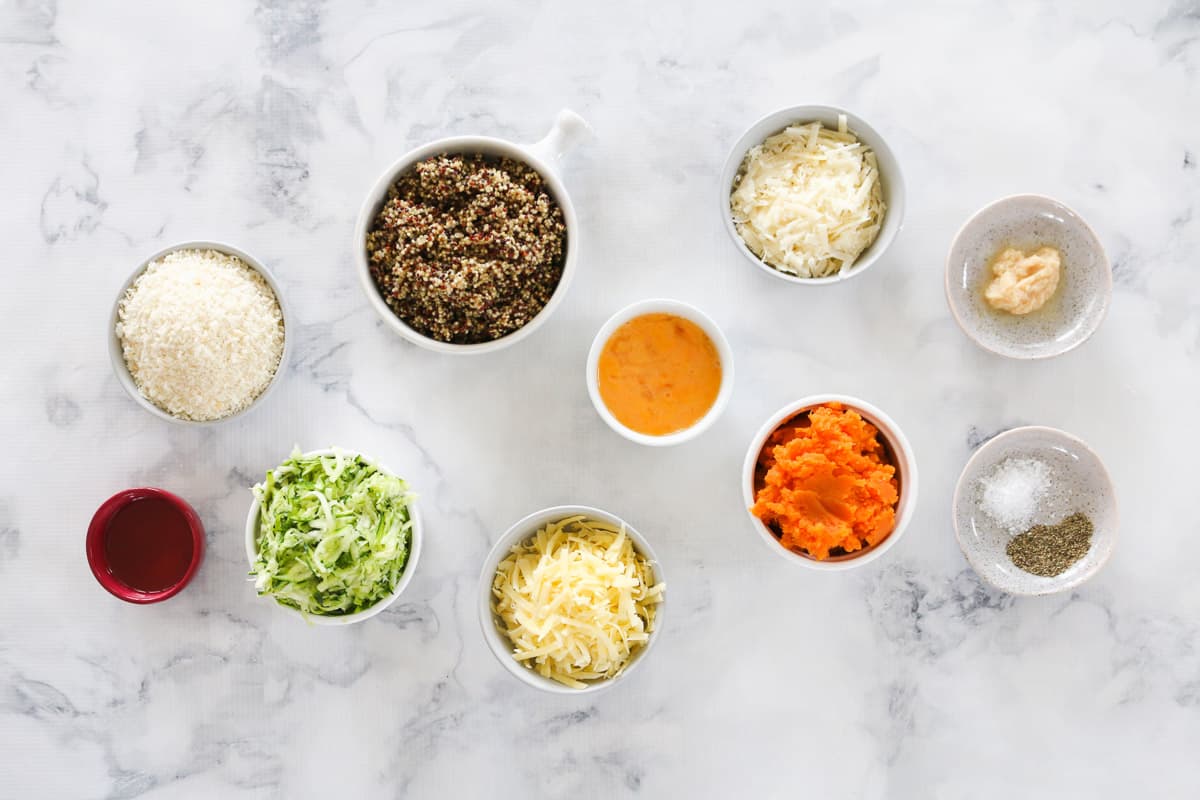 Ingredients for quinoa, zucchini and  sweet potato fritters in individual bowls