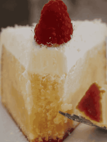 A slice of half-eaten white chocolate mud cake.