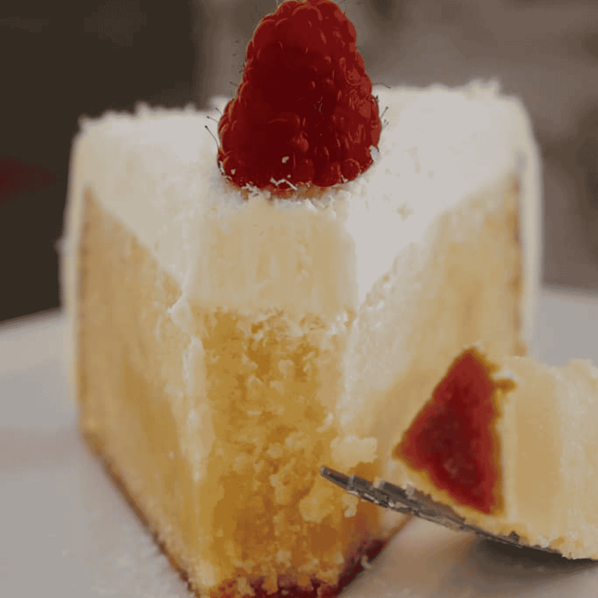 A slice of half-eaten white chocolate mud cake.