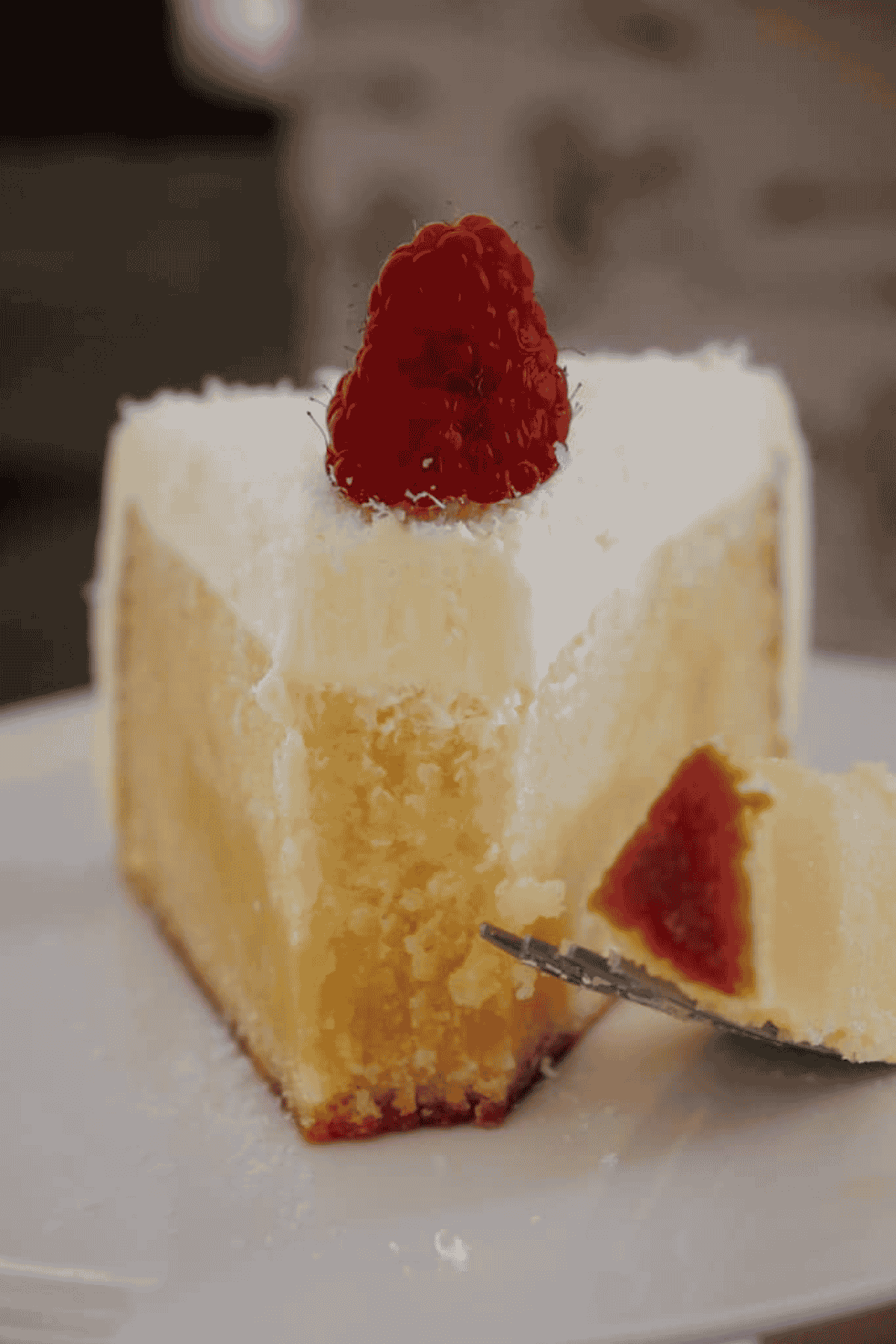 A half-eaten slice of white chocolate mud cake.