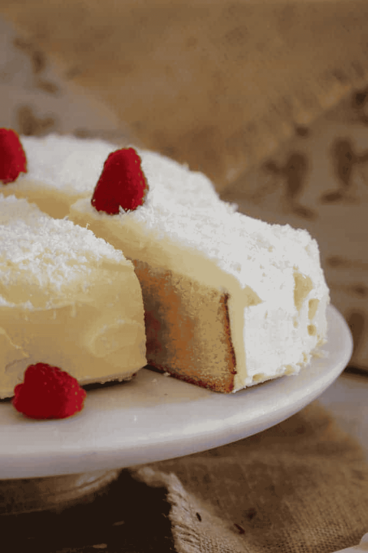 A slice of white chocolate mud cake being removed from the entire cake