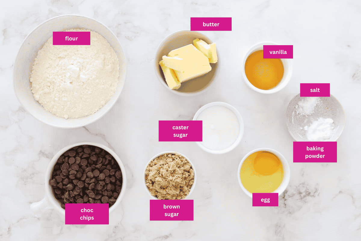 The ingredients for Chocolate Chip Cookies in small bowls.