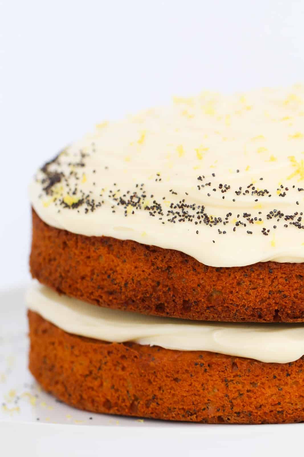 A two layer lemon cake with poppy seeds, and lemon cream cheese frosting.