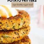 A stack of quinoa and vegetable fritters with sour cream and sweet chilli sauce on top.