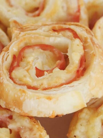 Cheese and ham roll ups made with puff pastry.