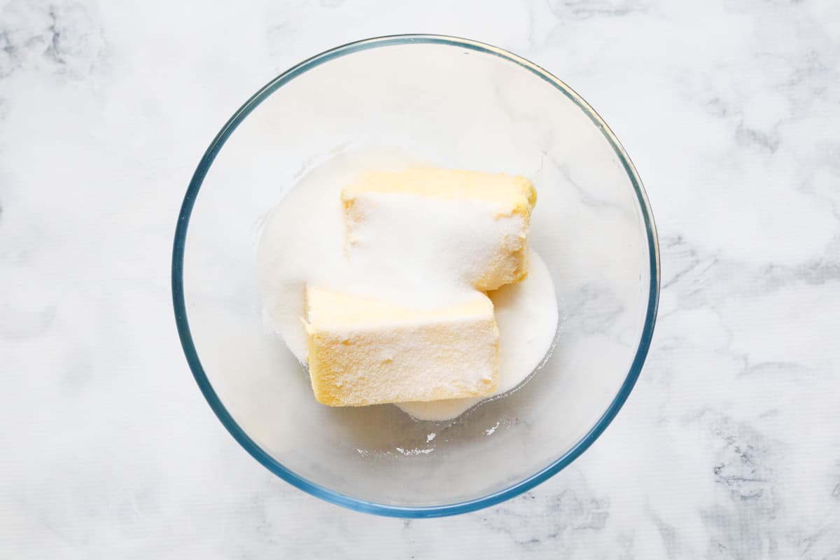 Butter and sugar in a large glass bowl.