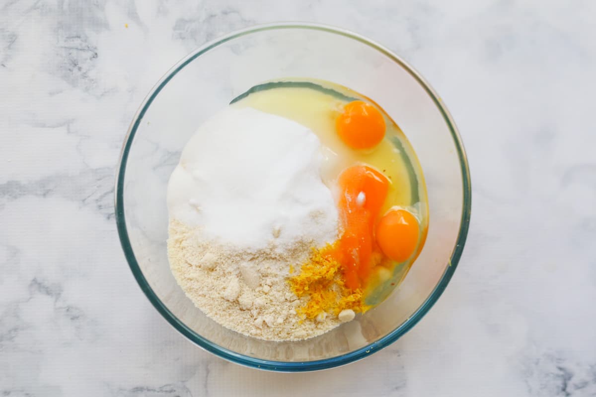 Eggs, lemon juice and zest, sugar, ricotta and almond meal in a mixing bowl