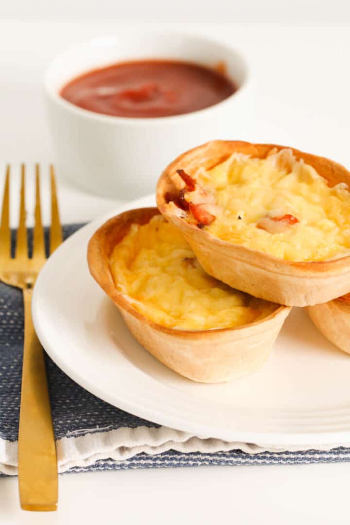 Cheesy Egg and Bacon Tortilla Quiches - Bake Play Smile
