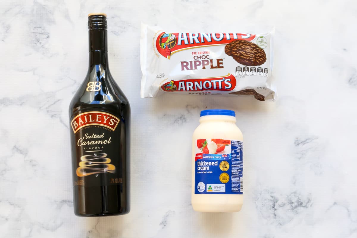 The 3 basic ingredients for a Baileys chocolate ripple cake on a marble bench