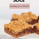 Squares of Date Crumble Slice, served on a white cake stand.