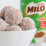 A bowl filled with malted milk and coconut balls.