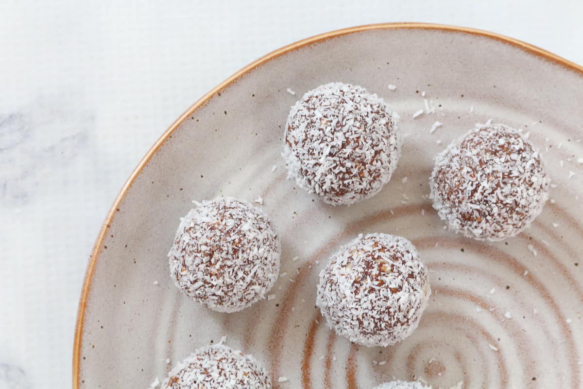 Coconut coated balls on a plate.