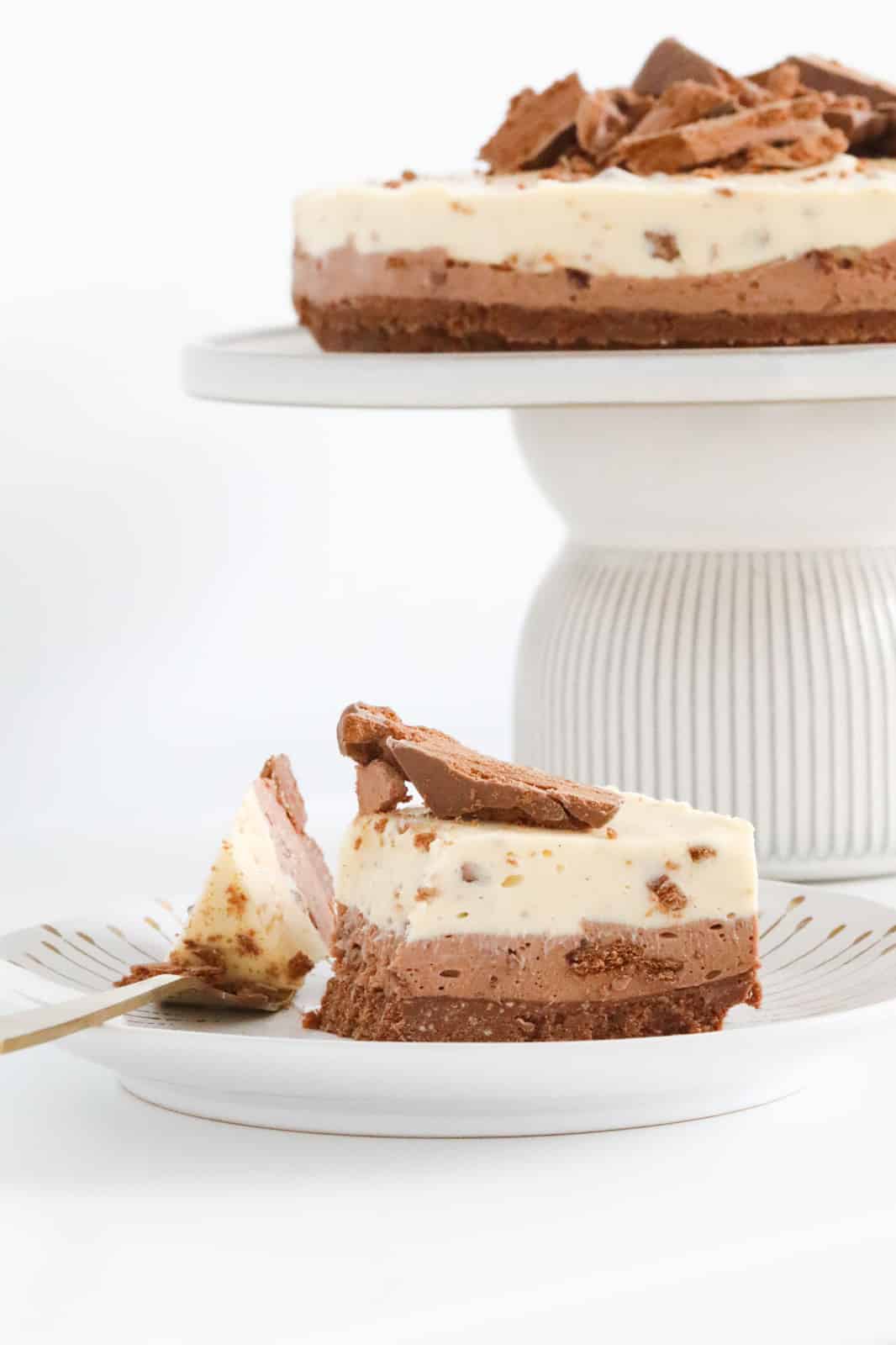 A serve of chocolate cheesecake, with some on a fork.