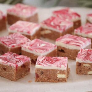 Pieces of Turkish Delight slice on a board.