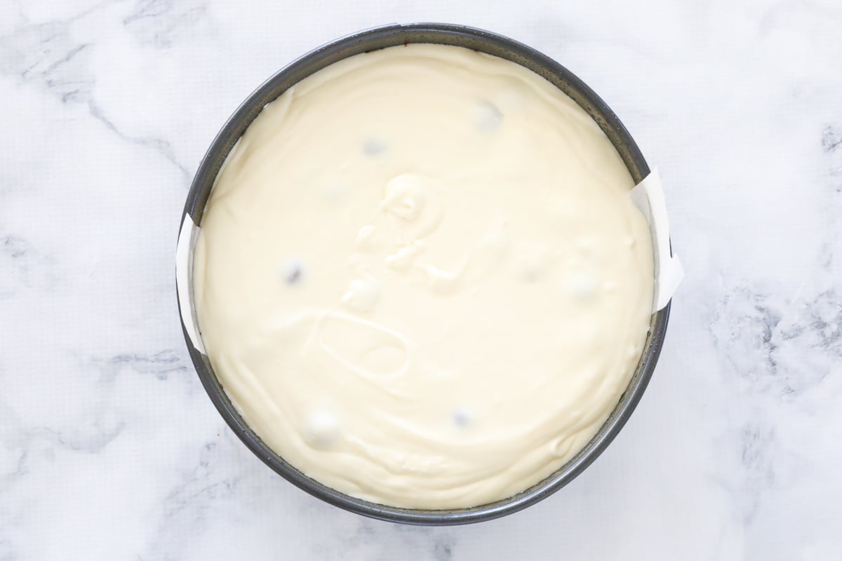 Malteser cheesecake in a springform tin.