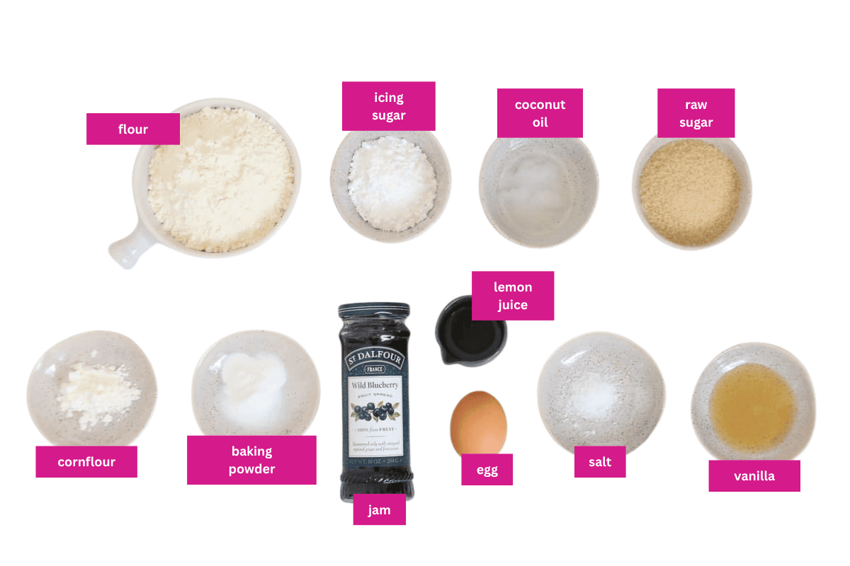 The ingredients for lemon and blueberry thumbprint cookies in small bowls.