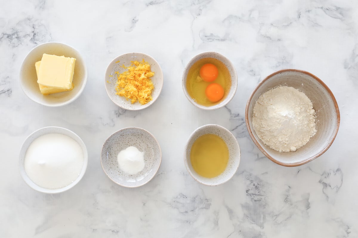 All the ingredients for baked lemon slice in individual bowls