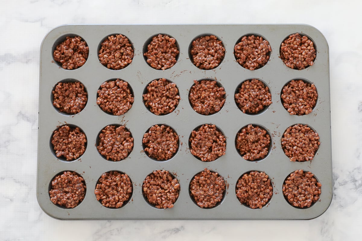 Chocolate crackles in a mini muffin tin.