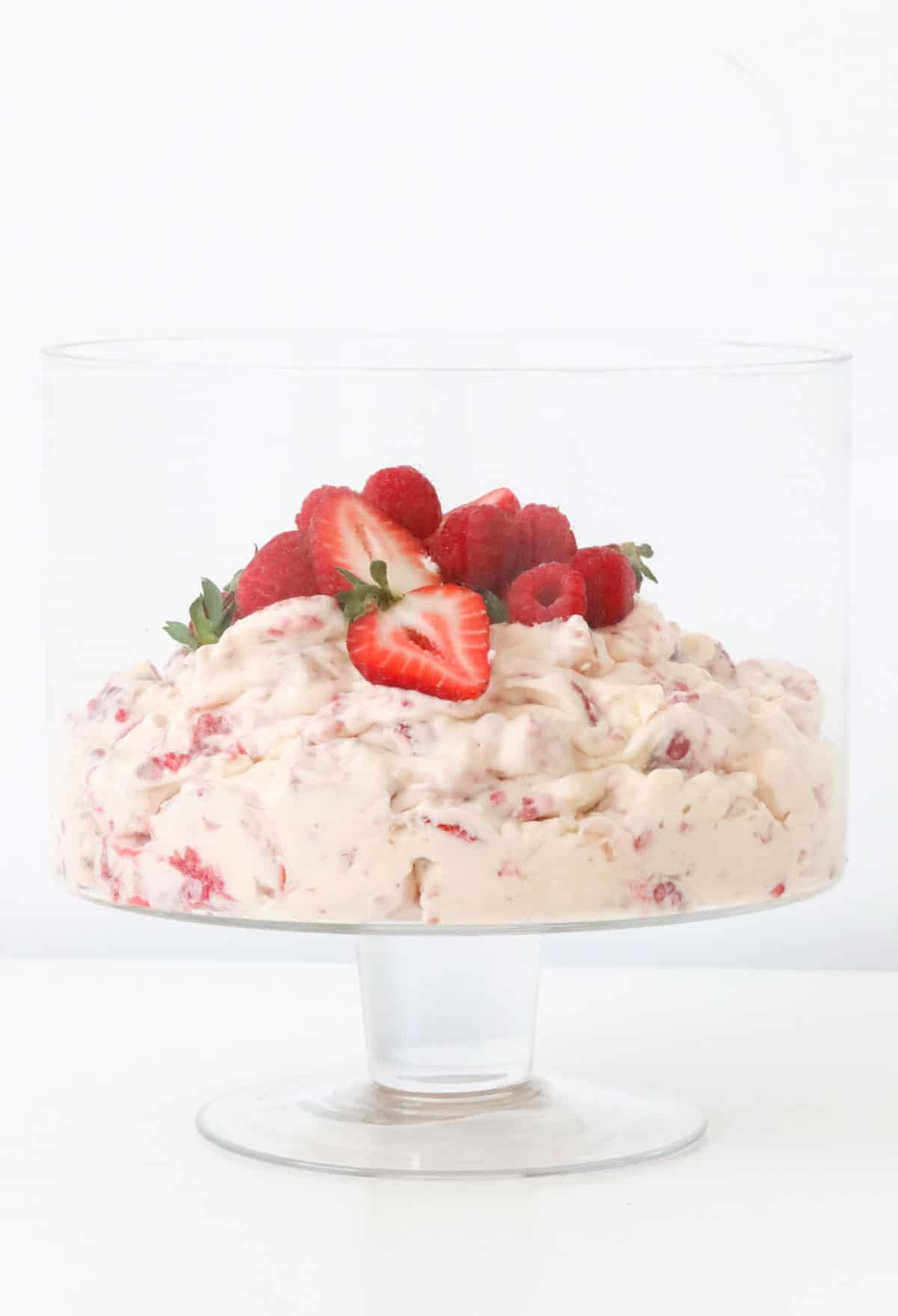 a bowl of finished eton mess, topped with strawberries