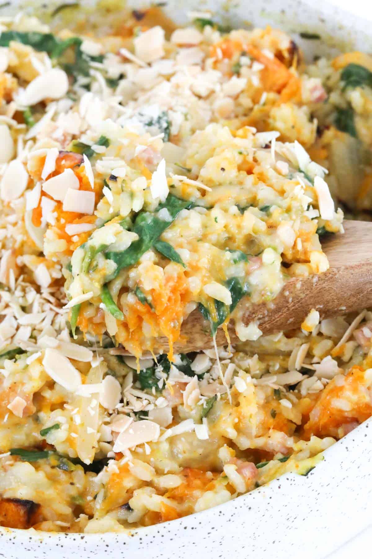 A spoonful of spinach and bacon and pumpkin risotto.