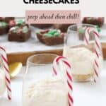 Dessert glasses filled with cheesecake and a candy cane to decorate the side of the glass.