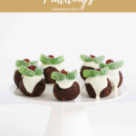 mini Christmas Puddngs served on a white cake stand