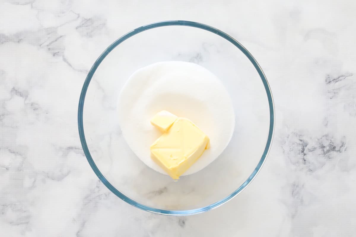 Butter and sugar in a glass bowl