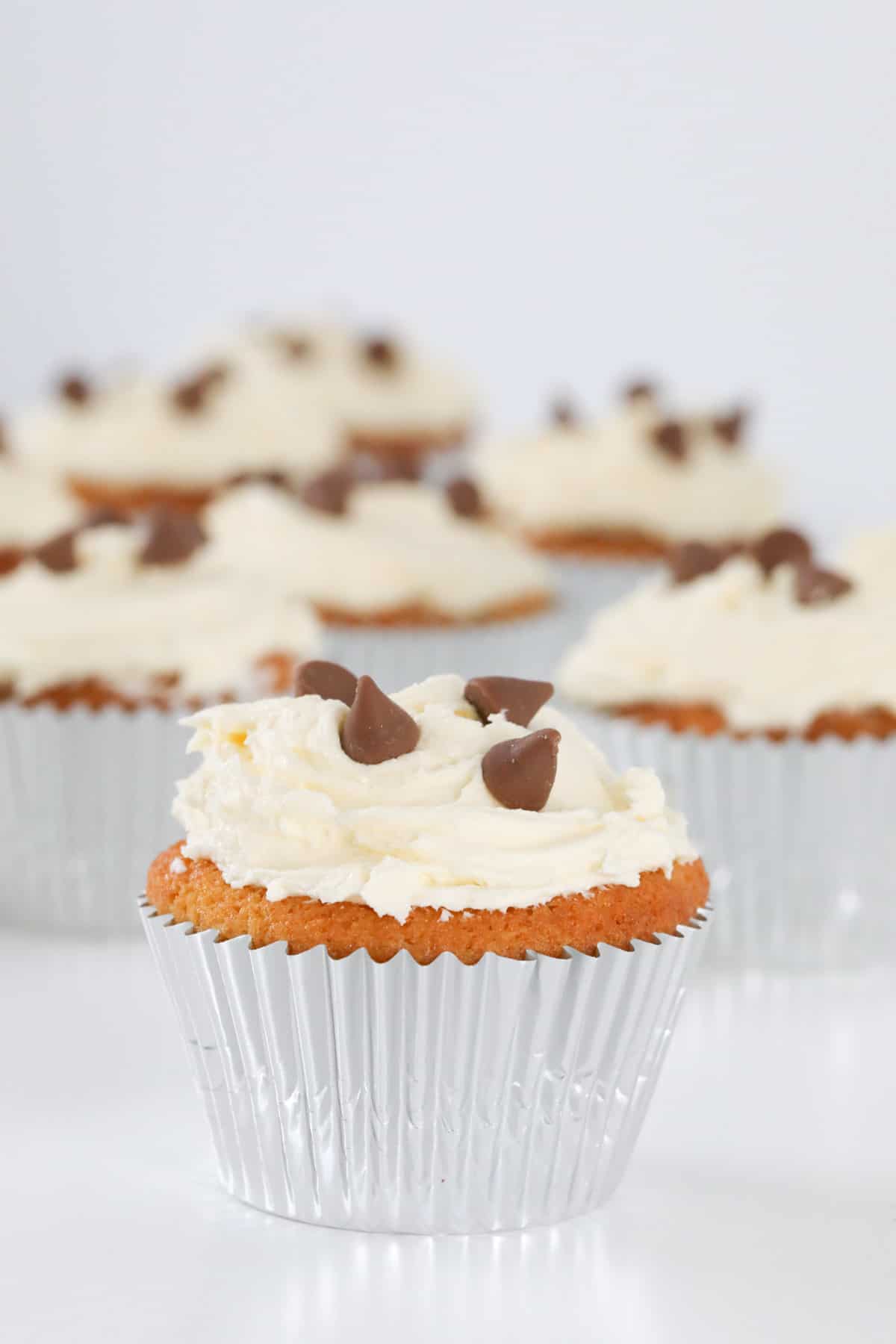 Chocolate chip cupcakes in silver cases.