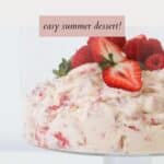 A creamy strawberry and meringue dessert topped with fresh strawberries.