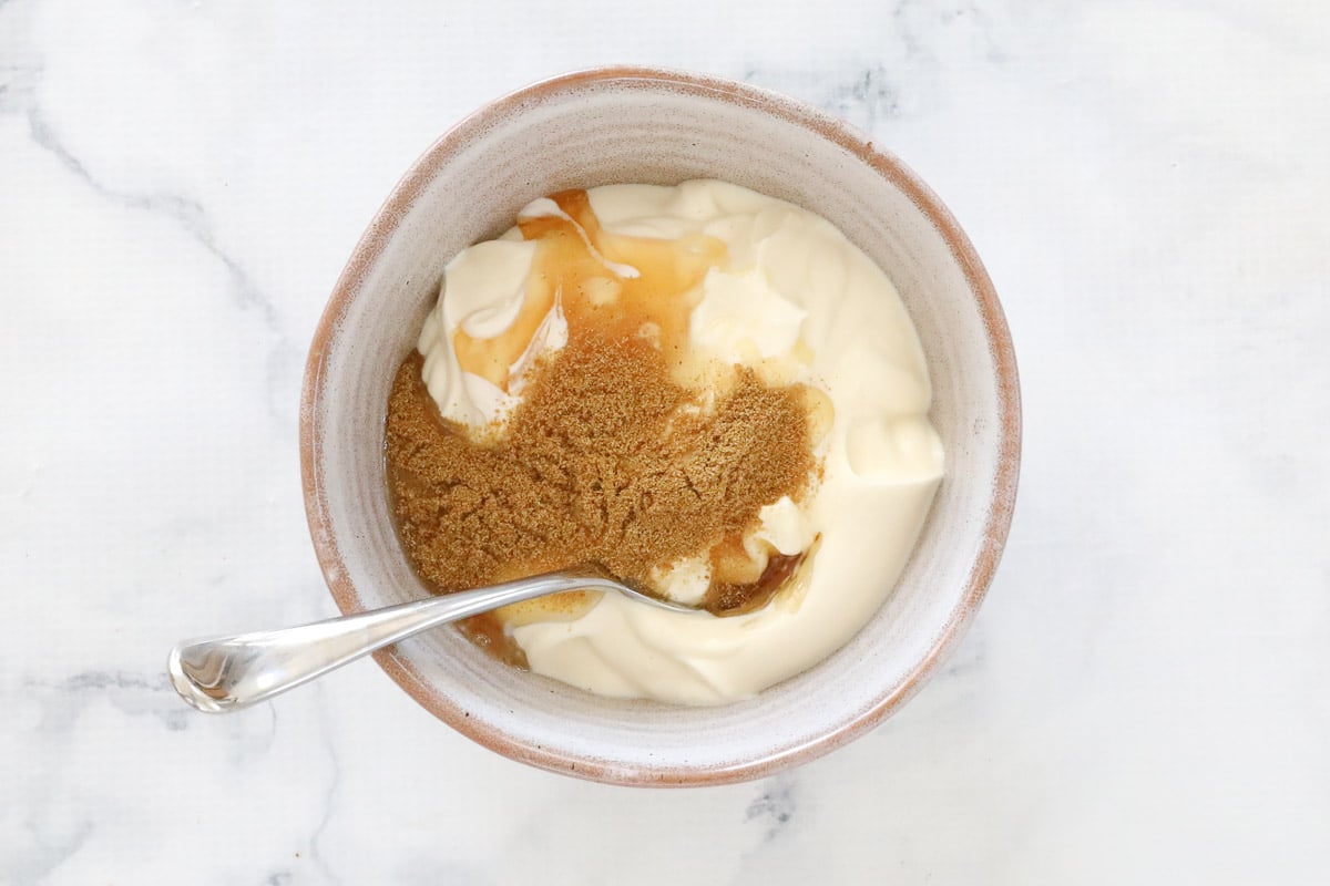 Greek yoghurt, honey and cumin in a bowl.