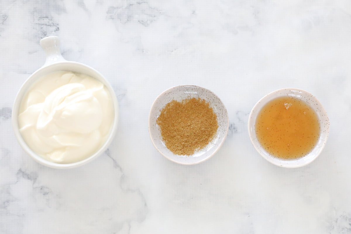 Greek yoghurt, cumin and honey in bowls.