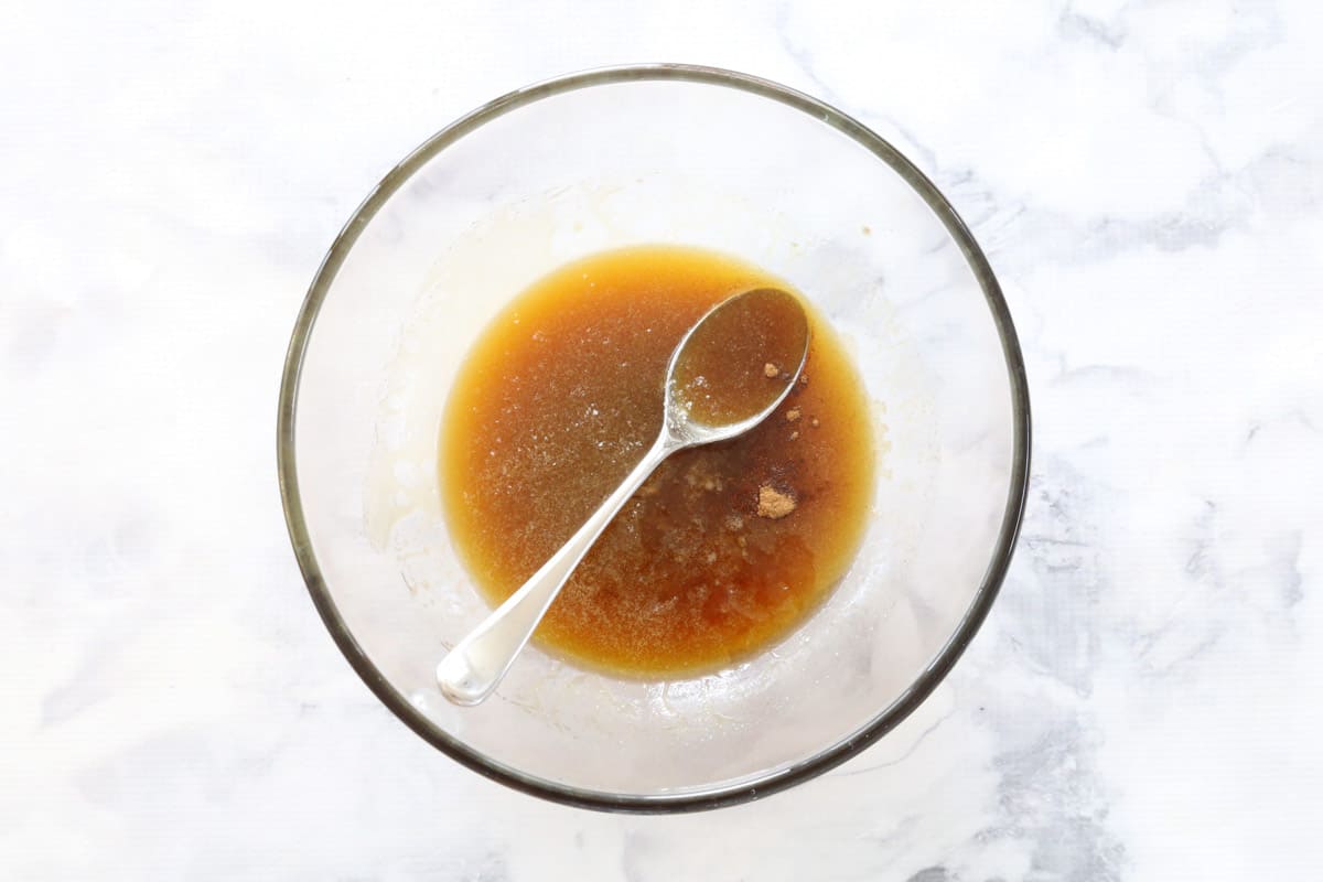 Melted butter, brown sugar and honey mixture in a glass bowl
